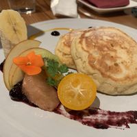 Pancakes served with coconut cream, ice cream and syrup at AIN SOPH.Ginza in Tokyo