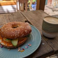 Bagel with fresh mango and avocado and a small cappuccino at Cafe Hinterzimmer in Freiburg