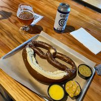 Vegan pretzel with vegan sauces (cheese, butter, and mustard). at Grid City Beer Works in Salt Lake City