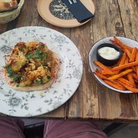 Cauliflower roasted on hummus with pea-greens. Sweet potato fries with vegan aioli (optional) at Salt & Pepper in Medulin