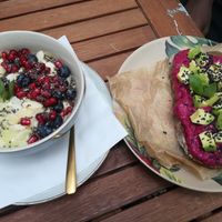 avodaco banana smoothie bowl and beetroot avocado hummus bread  at Artelier Cafe & Bar in Bratislava