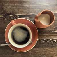 Coffee with jug of soy milk  at Black Cat Café in Gozo