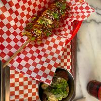 Corn dog and kimchi rice balls at Kitsune Burgers in Brussels