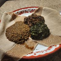 3 vegetable combo with misr wat, mustard greens,  and mushrooms. at Queen of Sheba in Portland