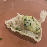 Feb 2024: Taster from the chef - cracker with vegan cod fish and Sicilian lemon. Amazing!   at Linfa in Milan