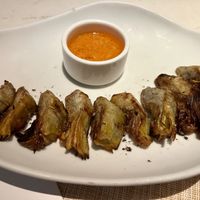 Grilled baby artichokes with romesco sauce   at BCN Taste and Tradition in Houston