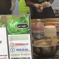 Signage promoting social media accounts and phone number contact at Vegan or Nah in Redlands