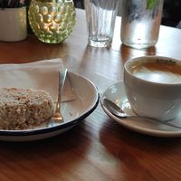 Decaf cappuccino and a half eaten Pear cinnamon cake at Lisa's Deli in Zwolle
