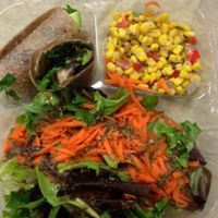 Spinach Portobello in coconut wrap, corn salad and side salad with Herbes de Provence house dressing.  Excellent raw vegan lunch! at The Garden Kitchen in Houston