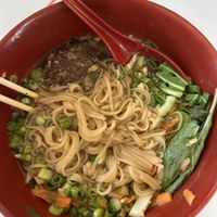 Impossible rice noodle bowl (partially eaten)   at 86 Forks Bar + Table in Pensacola