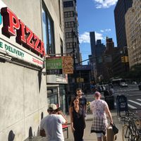Front of venue--notice announcement for vegan pizza. at Kiss My Slice in New York City