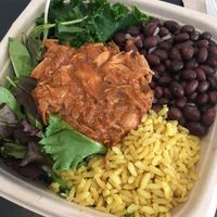Bowl with greens, marinated kale, savoury rice, black beans and jackfruit at Blossom Du Jour - Chelsea in New York City