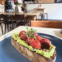 Avocado toast with cherry tomatoess  at South Coast in Bournemouth