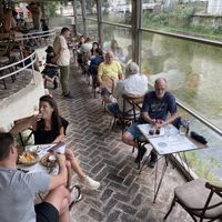 Terrace- the sun came out and they raised the windows for open air  at Resto Bar Taraca in Kotor