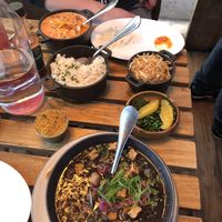 We split the vegan stroganoff (orange in back of photo) and vegan feijoada (black in front of photo) both were so delicious but the feijoada had my heart   at Berimbau Brazilian Kitchen in New York City