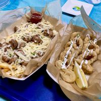 Salchipapas y calamares veganos muy ricos at Cala Vegana in Menorca