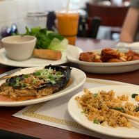 Spread of egg rolls, fried rice, garlic chick'n, fish, Thai tea at Thuyen Vien in Anaheim