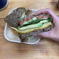 Just egg, follow your heart cheddar, avocado, cucumber and tomato on whole grain bread!  at Roots Lounge in Toms River