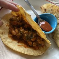 View inside vegan tacos: a soy meat and tomato sauce, some veggies, and don’t miss the Spanish pimento sauce that looks like ketchup but tastes!!! at La Hormiga in Pontevedra