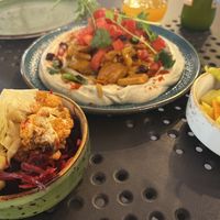 hummus shawarma, with pickled sides  at Bliski Wschód in Warsaw