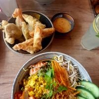 Bowls with mycket meat and rice noodles and tempura at La Vegana in Warsaw