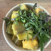 Small bowl tofu and plantain  at La Vegana in Warsaw