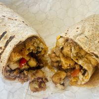 Bean Burrito with vegan cheese and added tofu. Was great & big!  at Kindbelly Cafe in Myrtle Beach