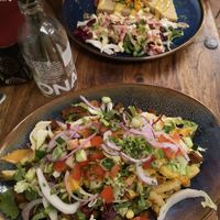 Kapsalon and a seasonal dish in the background at Pfannenzauber in Aachen