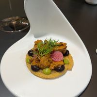 Masa churro, chanterelle, black garlic, pipian rojo, and mezcal.  at MITA in Washington