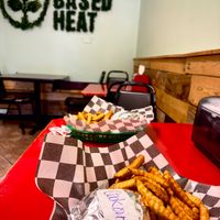 Cool green sign on the back wall! at Plant Based Heat in Memphis