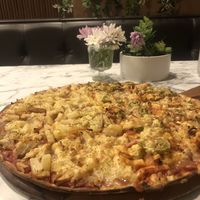 Half “chicken” Hawaiian, half peri peri “chicken"  at Joe's Pizza Bar in Brooklyn Park