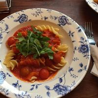 Vegan friendly, pasta pomodoro. Giant fusilli spirals, cherry tomatoes, olive oil, basil, black pepper. Was a lovely alternative to the usual option of just "chips" in other places. at The Glass House in Norwich
