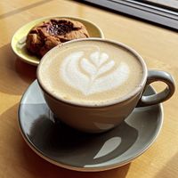 Maple latte with oat milk and a vegan oat cookie  at Fuego Coffee Roasters in Rochester