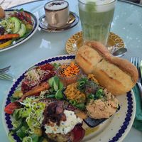 Herzhaftes Frühstück mit Matcha Latte (im Hintergrund herzhaftes Frühstück mit Cappuccino) at BABA Handmade Cafe in Leipzig
