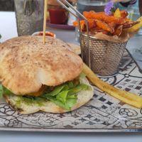 Vegan burger with fries at Organic in Mallorca