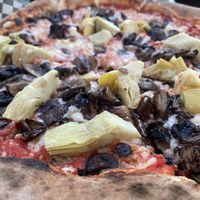 Custom vegan pizza with artichoke hearts, roasted mushrooms, and vegan cheese. SUPER GOOD!! Great crust too. at Hey Neighbor in Eugene
