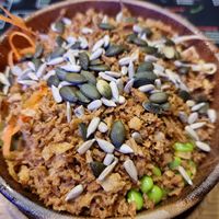 small bowl with tofu, sticky rice, edamame, avocado soy sprouts, nuts and seeds, ... at Moana Pokebowls in Bruges
