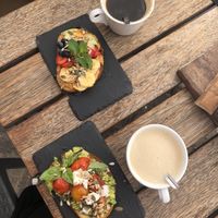 tostadas de crema de cacahuete con fruta y de aguacate, tomate y ‘queso’ feta. at Esquina in Lanzarote