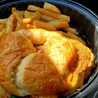 Coltrane croissant sandwich with fries at Mo' Brunch + Brews in Houston