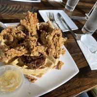 Chicken fried shooms waffle with a cheeky side sausage thrown in 😃  at Mo' Brunch + Brews in Houston