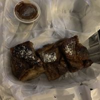 Croissant pudding bread with caramel to go  at Mo' Brunch + Brews in Houston