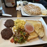 sausage patties, scrambled Just Egg, breakfast hash, sourdough toast, wafflees  at Mo' Brunch + Brews in Houston