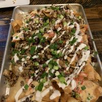 The loaded nachos were huge. The smoked mushrooms tasted like we were at a bbq    at Mo' Brunch + Brews in Houston