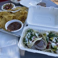 vegan pinto bean tacos with chips and salsa, guacamole  at Coco Loco Taco Bar in Sisters