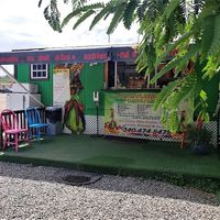 Right on the main drag in Red Hook.  To the right there is a small covered bench if you want to sit and sip.   at Kween Vee Smoothies in St Thomas