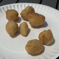 Individual zeppoli size comparison to a paper plate  at Moto Pizza in Falmouth
