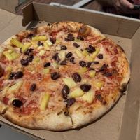 Vegan custom pie with olives and pineapple  at Moto Pizza in Falmouth