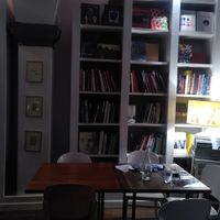 Restaurant tables in the library at Brac Libreria di Arte Contemporanea in Florence