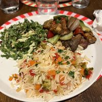 Insalata di cavolo, mele e melograno con salsa speziata, riso fiorito con crema e broccoli, tempeh funghi pak choi e salsa simil maionese   at Brac Libreria di Arte Contemporanea in Florence