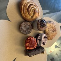 The five items in the middle are from here: Black Forest tart, soufflé, strawberry tart, wownie & brioche crème brûlée. The cinnamon roll and pain su chocolate are from Cafe Tu at Pâtisserie Zébulon in Montreal